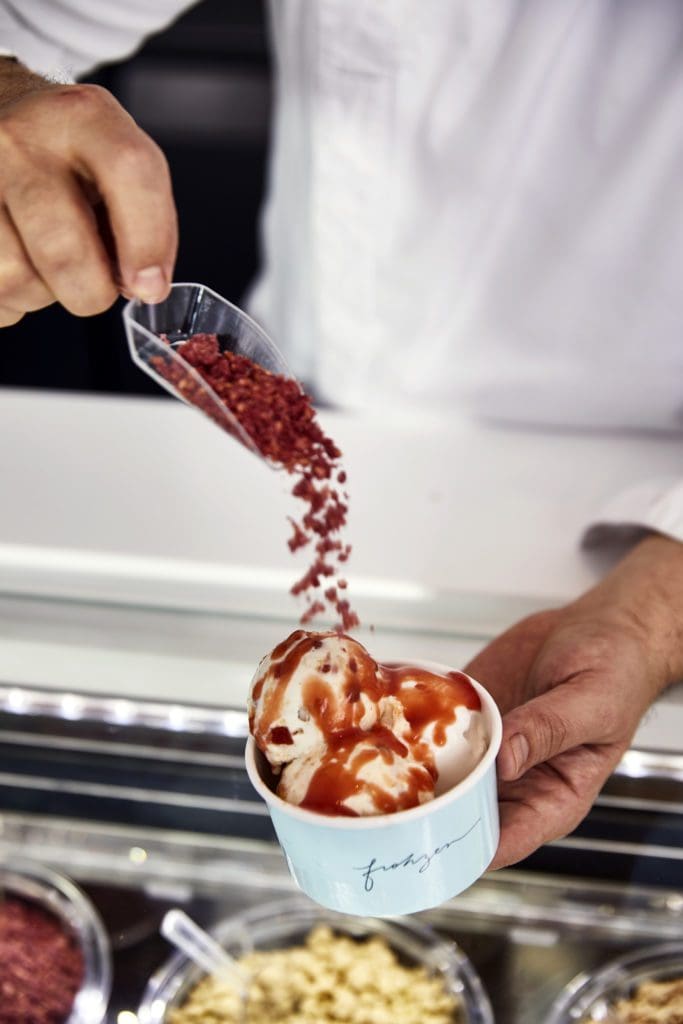 Ice cream scoops at Frohzen come with choices of crumbles, sauces and sprinkles. Here it is guava sauce with raspberry crumbles.