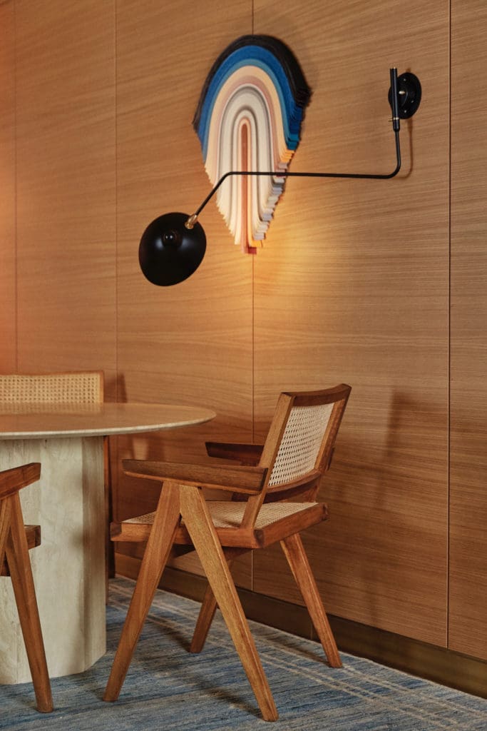 Paper wall sculpture by Derrick Velasquez, Denver. Vintage travertine table from 1stdibs. (Photo by Max Kutz)