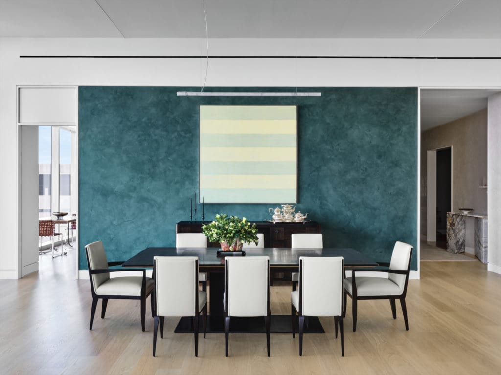 Agnes Martin's Untitled #15 in the dining room. Console and table by Ludwig & Dominque, Paris. The silver tea service belonged to the homeowner's late wife. Vintage Mattaliano chairs. Alfredo Salvatori marble light fixture. (Photo by Douglas Friedman)
