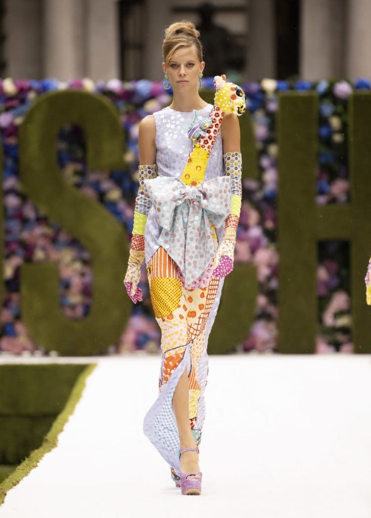 A Moschino dress features a three-dimensional giraffe that pops up from the decollete with a baby monkey clinging to its neck. (Photo courtesy of Moschino)