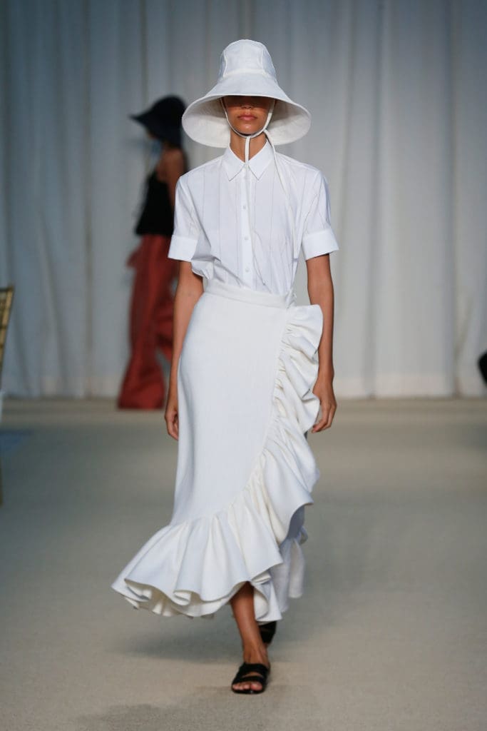 Adam Lippes white laser cut poplin top, ivory linen ruffle skirt, ivory linen hat. (Photo courtesy of Adam Lippes)