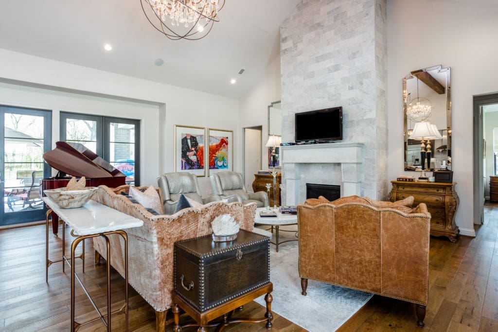 A living room is all about, well, life and passion and gathering with family and friends. Use a focal point, such as a fireplace, and build off of it.