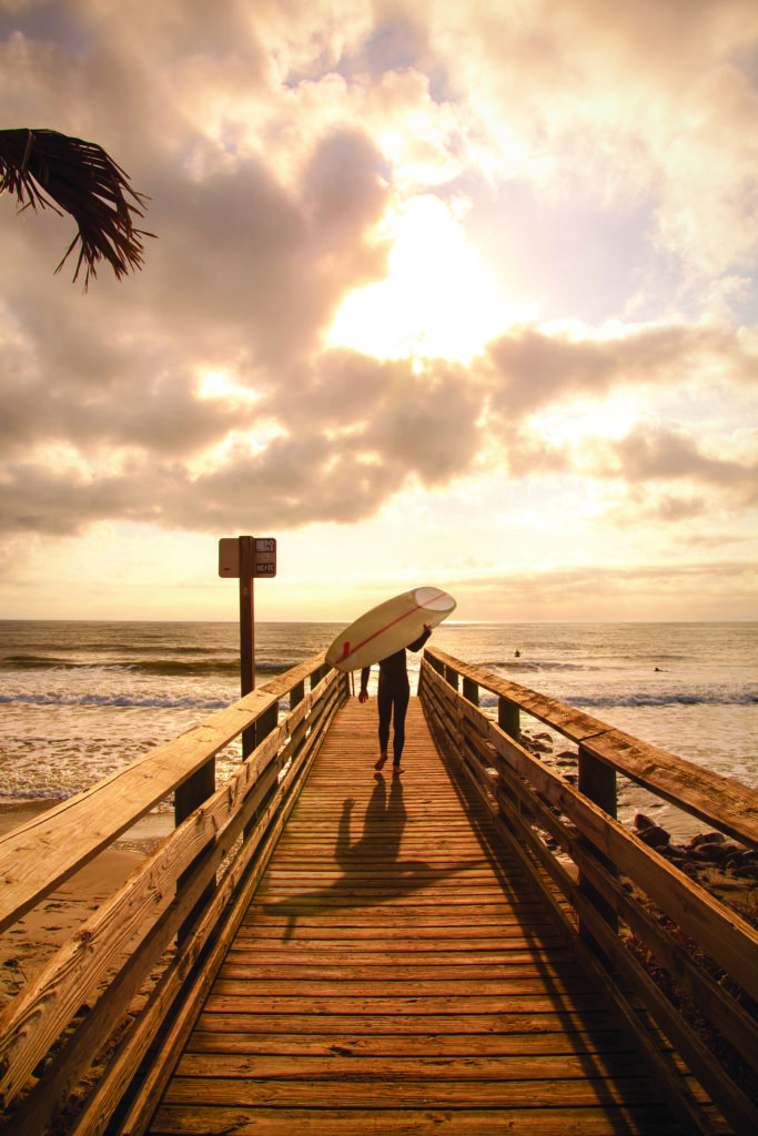 A surfer sets out to ride a wave on Folly Beach. (Photo Doug Hickok)
