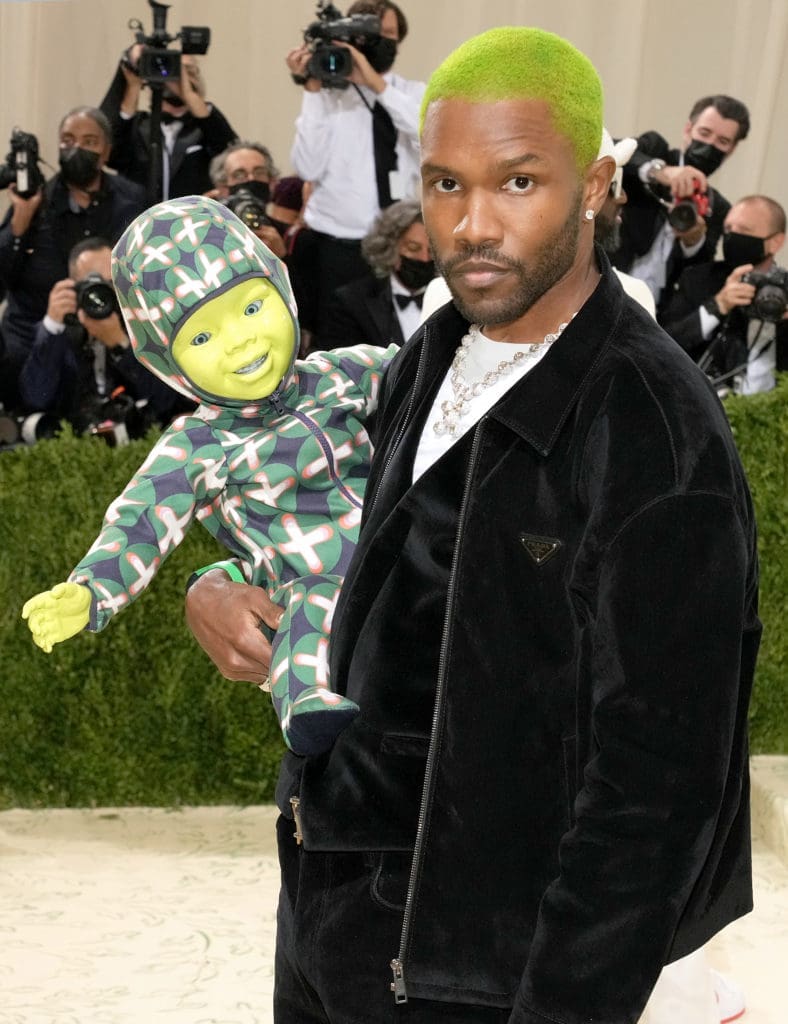 Frank Ocean wears a Prada black velvet jacket, vest and denim pants with a white stretch cotton T-shirt.
(Photo by Jeff Kravitz/FilmMagic)