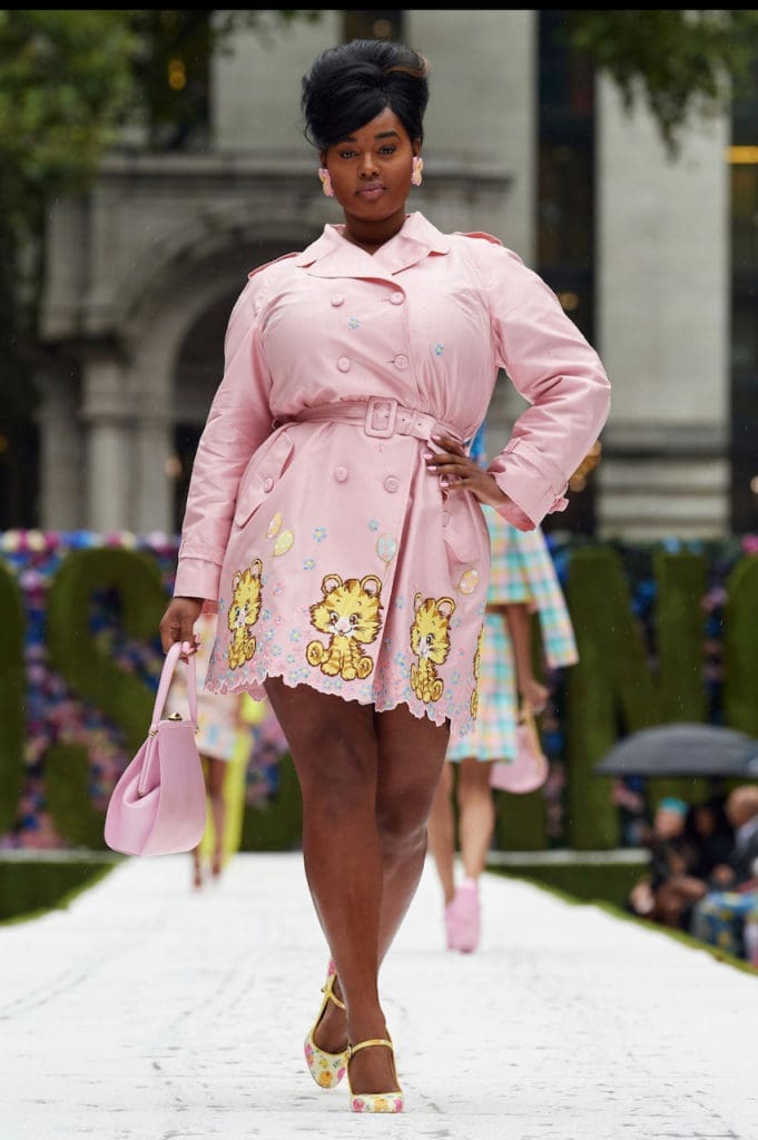 Moschino pink trench coat with yellow cartoon character patches. (Photo courtesy of Moschino)