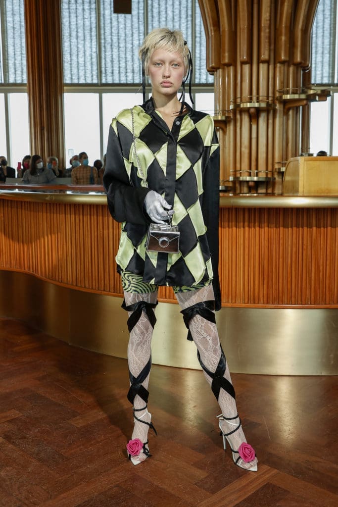 Maisie Wilen lime/black jockey shirt, vortex yellow revenge body catsuit, silver mirror Lola bag.  (Photo by Arturo Holmes/Getty Images)