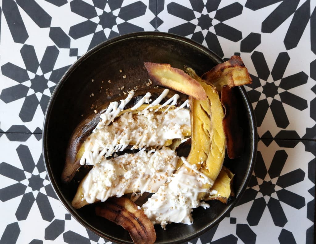 Urbe's platanos rostizados is an oven-roasted plantain with creme dulce and quest fresco topped with crispy plantain chips. (Photo by Paula Murphy)