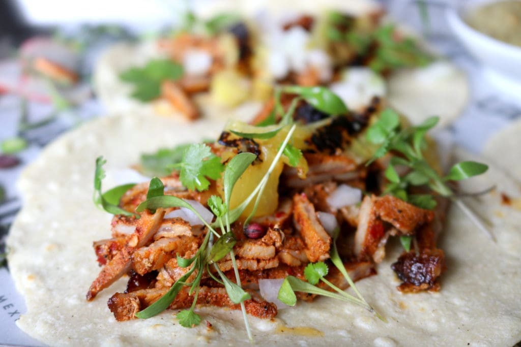 Tacos al Pastor, a signature dish is made with pork, charred pineapple with a habanero salsa wrapped in a corn tortilla. (Photo by Paula Murphy)