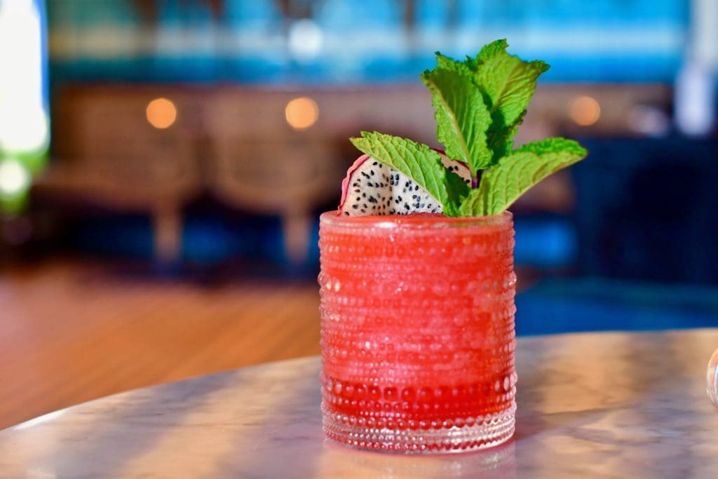 This is the Tuluminatia, a reposado tequila and dry curacao drink with lime, agave and dragon fruit syrup. (Photo by Michael Anthony)