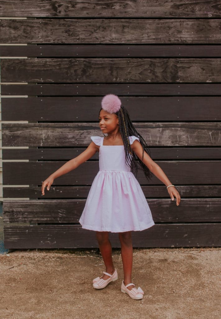 The pink and white seersucker flutter sleeve sun dress by cuteheads.
