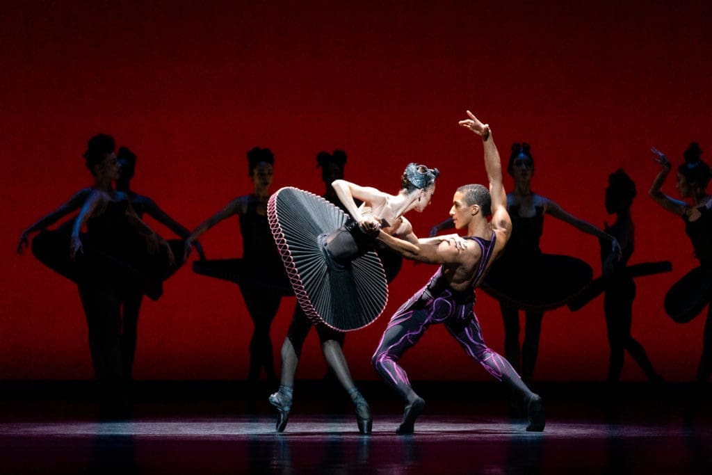 Houston Ballet Soloists Mackenzie Richter and Harper Watters with Artists of Houston Ballet in Stanton Welch’s 'Divergence.'
(Photo by Courtesy of Houston Ballet. Lawrence Elizabeth Knox,2021)
