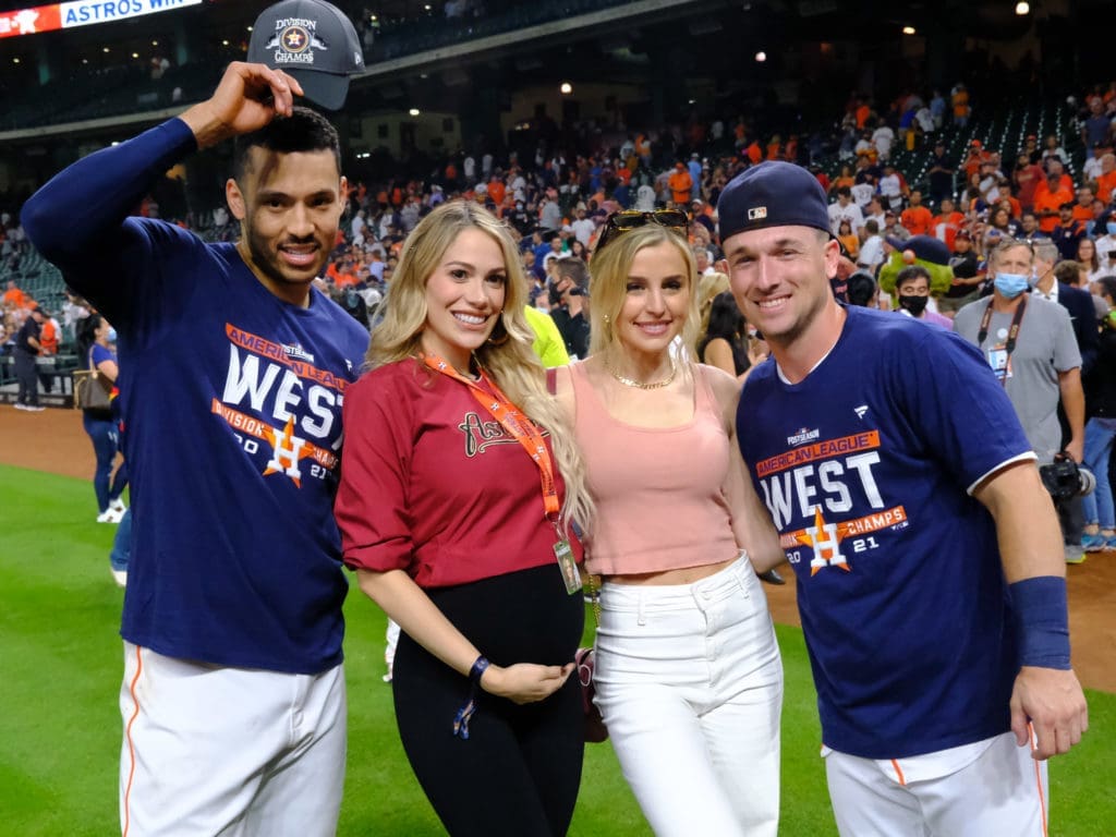 Talk about couples in baseball. Carlos Correa and his wife Daniella and Alex Bregman and his wife Reagan posed on the field after the Astros clinched another AL West title. years ago. (Photo by F. Carter Smith)