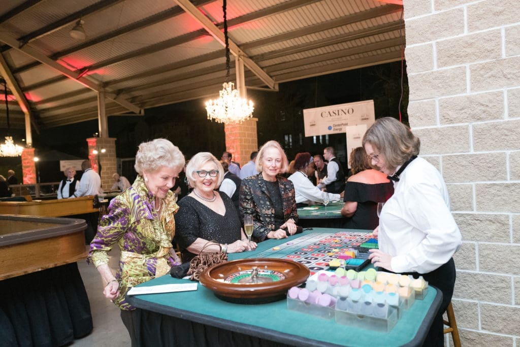 Emily Crosswell spins the wheel at the gaming table (Photo by Daniel Ortiz)