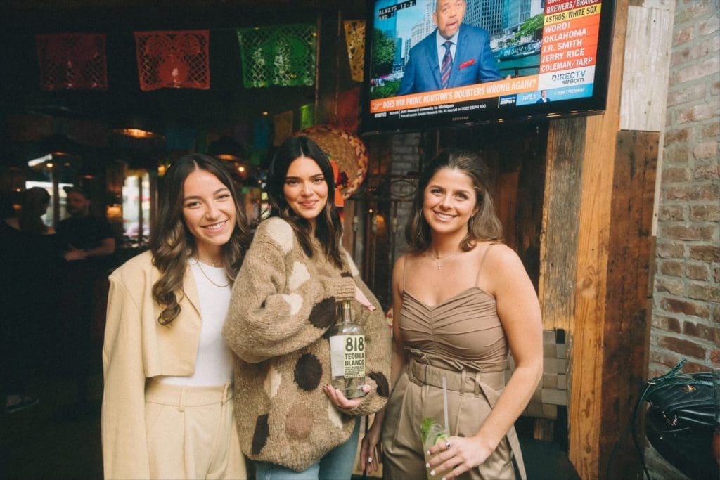 Kendall Jenner, center, and Blayne Feritta, right, and pal shake up Jenner's 818 Tequila cocktails at Dos Caminos in New York's meatpacking district. (Photo by Sophia Sahara)