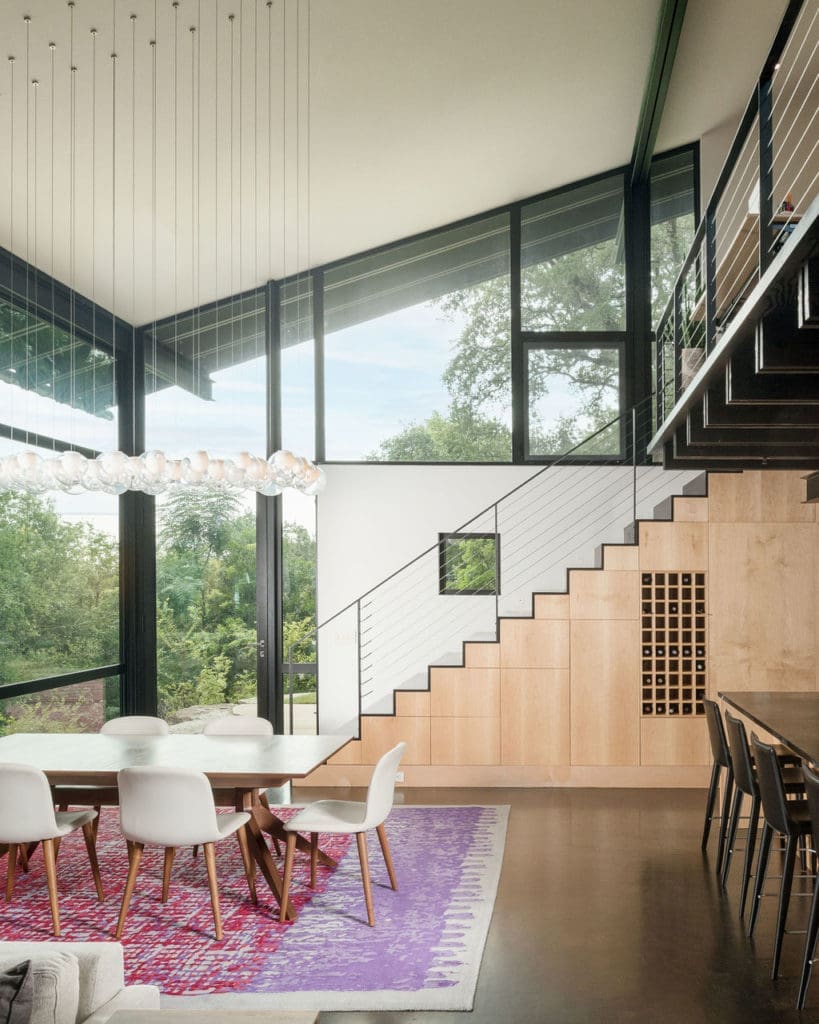 A giant screened porch connected to the main living room (and featuring a fireplace with ceramic balls) was the star of this stunning, Rollingwood home. (Photo by Tobin Davies Photography)