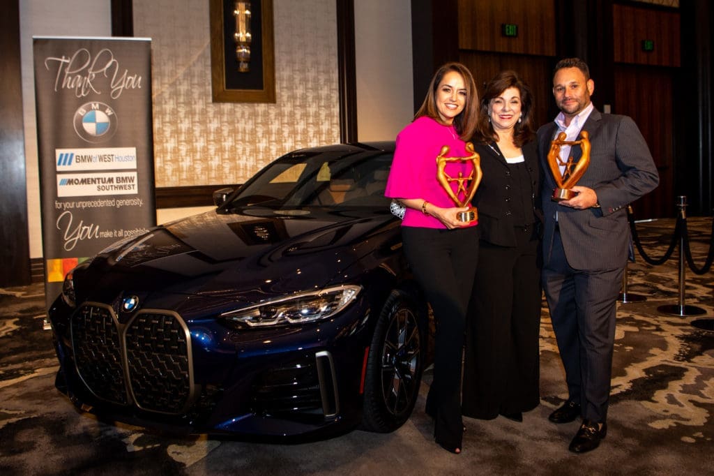 Houston Children's Charity luncheon sponsors Maria Moncada Alaoui and Tommy Kuranoff flank HCC CEO Laura Ward at the 25th anniversary luncheon. (Photo by Michelle Watson, catchlightgroup.com)