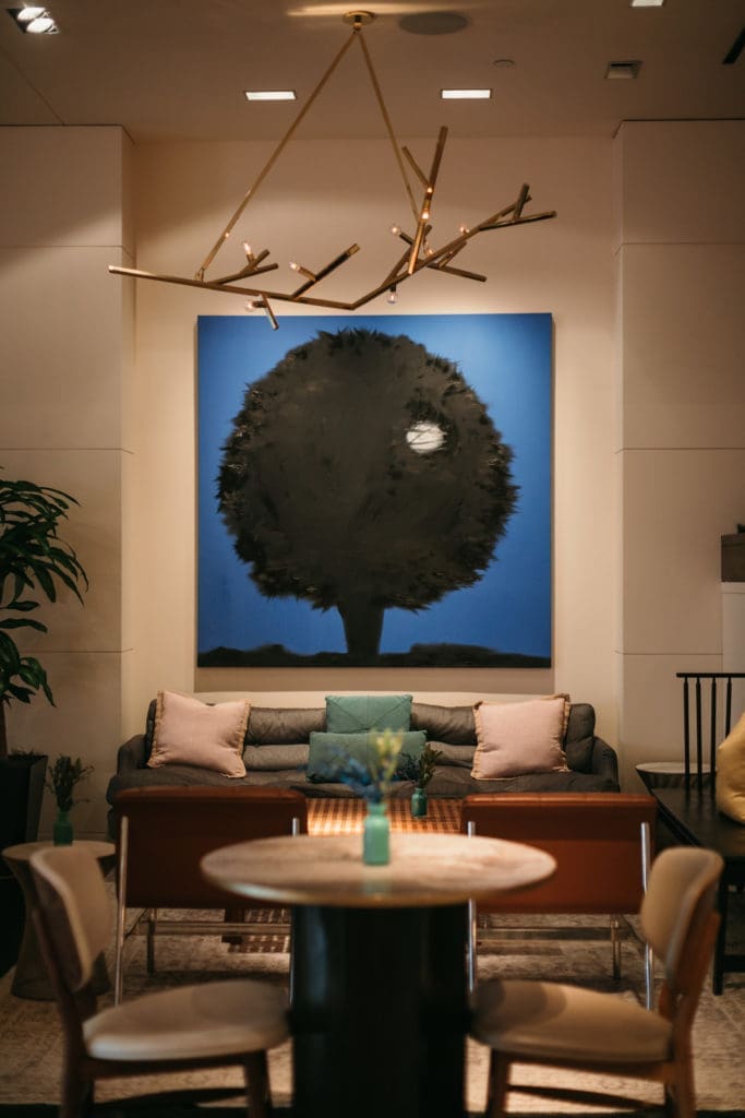 Ann Craven's paintings at The Joule include a pair of black trees hiding the moon.
