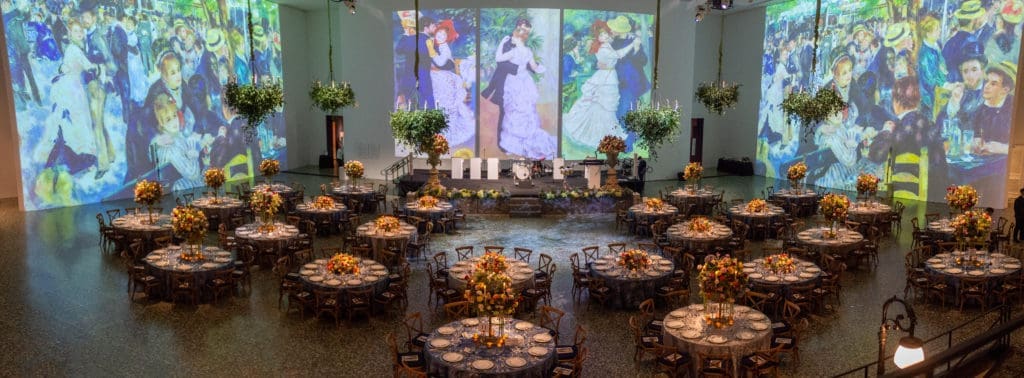 Walls of the grand hall in the Museum of Fine Arts, Houston Caroline Wiess Law Building swathed in images from Renoir's 'Dance at Bougival' for the Grand Gala Ball. (Photo by Jenny Antill)