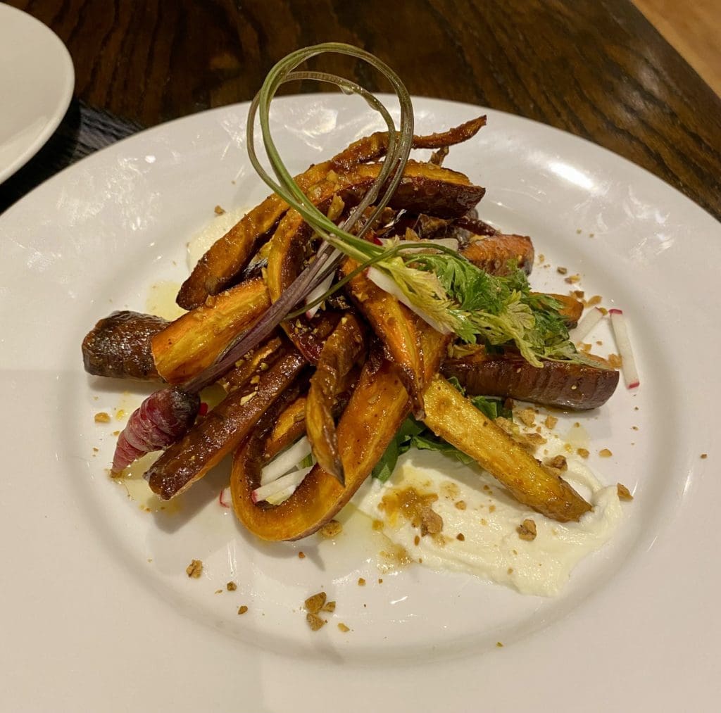 The roasted rainbow carrot salad with whipped ricotta and pistachio brittle might as well be a dessert at Beckley 1115. (Photo by Megan Ziots)