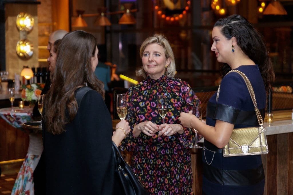 Kit Sawers (center) chatting with guests (Photography by William Neal).   (Photo by William Neal)