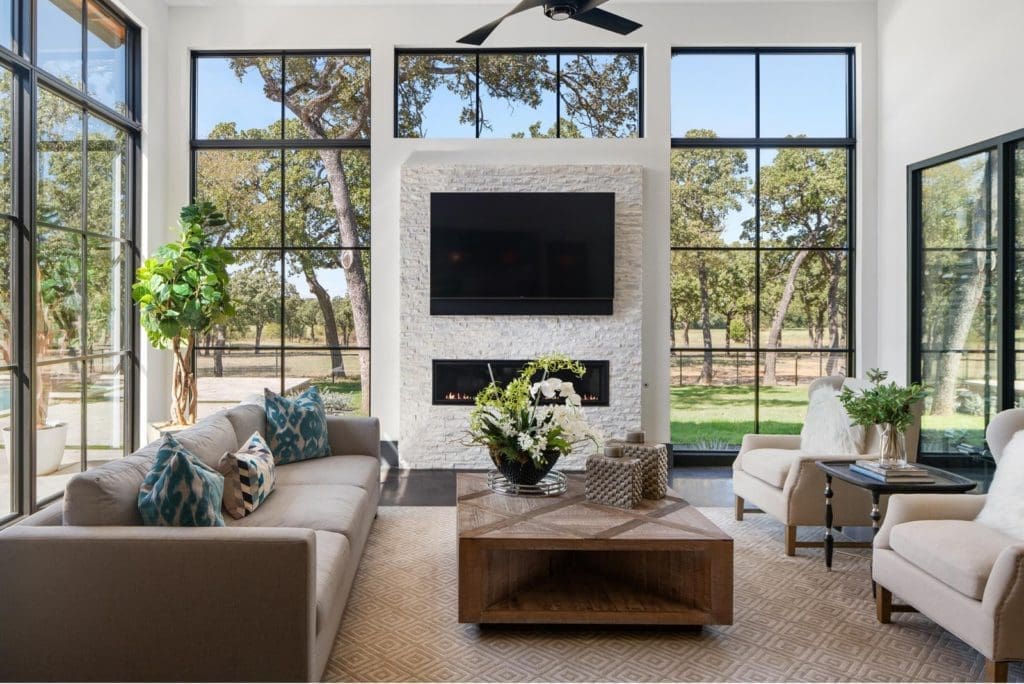 1200 Rockgate Road boasts three-sided walls of glass bringing the outside into the great room. Photos courtesy of Zach Spross, for Douglas Elliman.