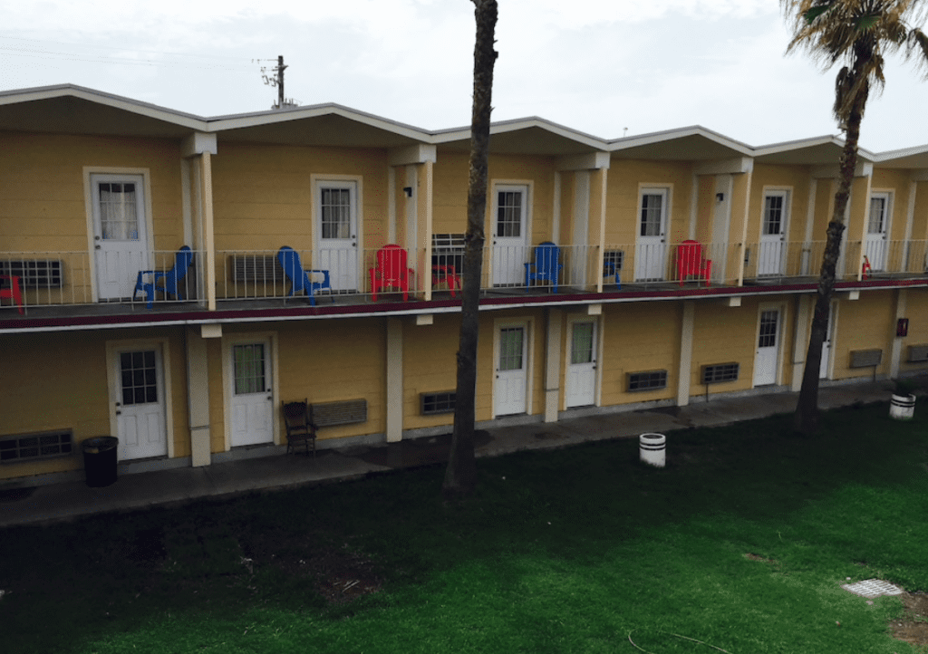 The garish yellow facade of the now-closed Pearl Inn will be reimagined in serene colorations suggested by white brick and bleached white oak.