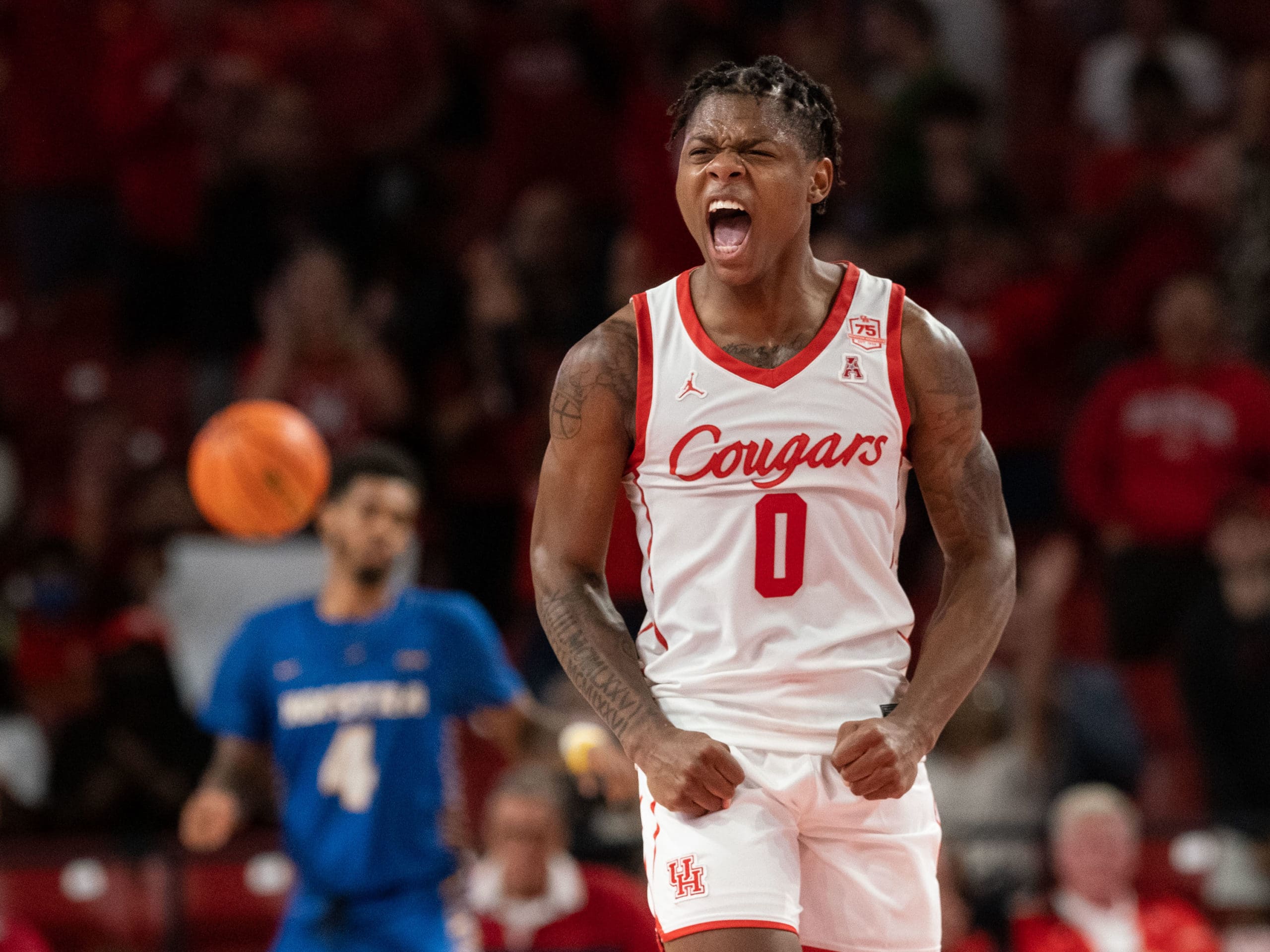 University of Houston Cougars men’s basketball team opened their 2021-2022 season with an overtime victory over the HofstraPride, complete with the presentation of a banner commemorating their trip to last season’s Final Four, Tuesday night at the Fer