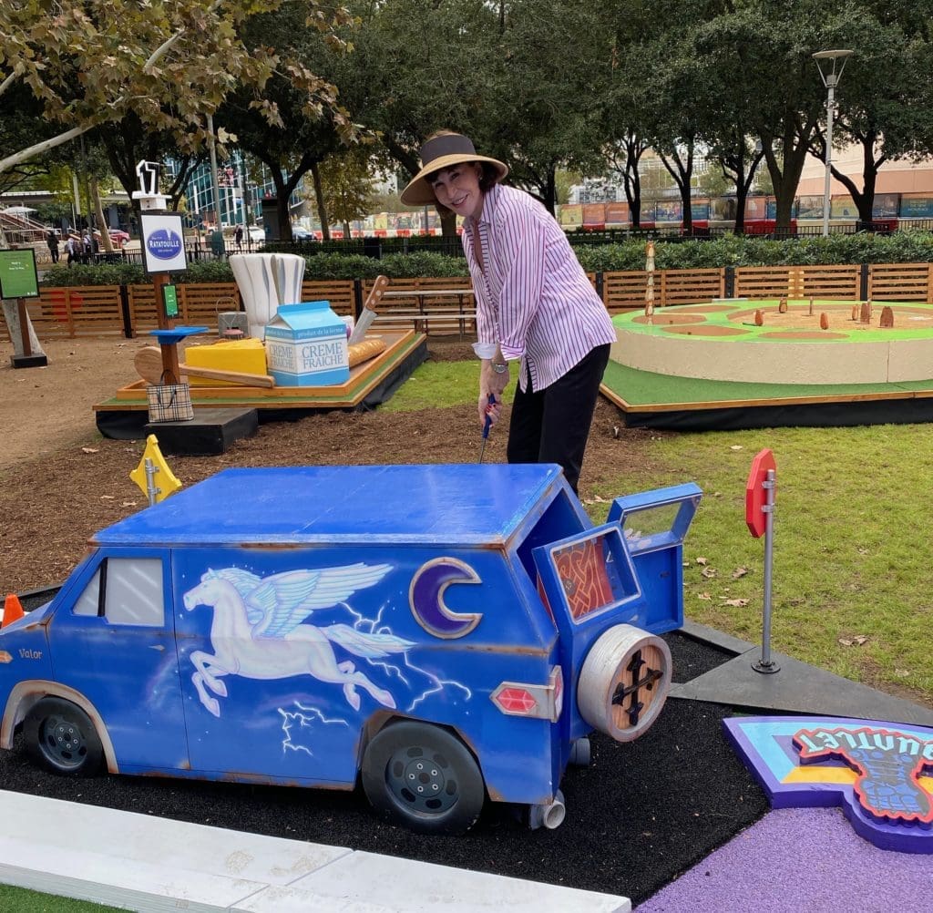 PaperCity social and lifestyle editor Shelby Hodge tries her hand at Pixar Putt now open at Discovery Green.
