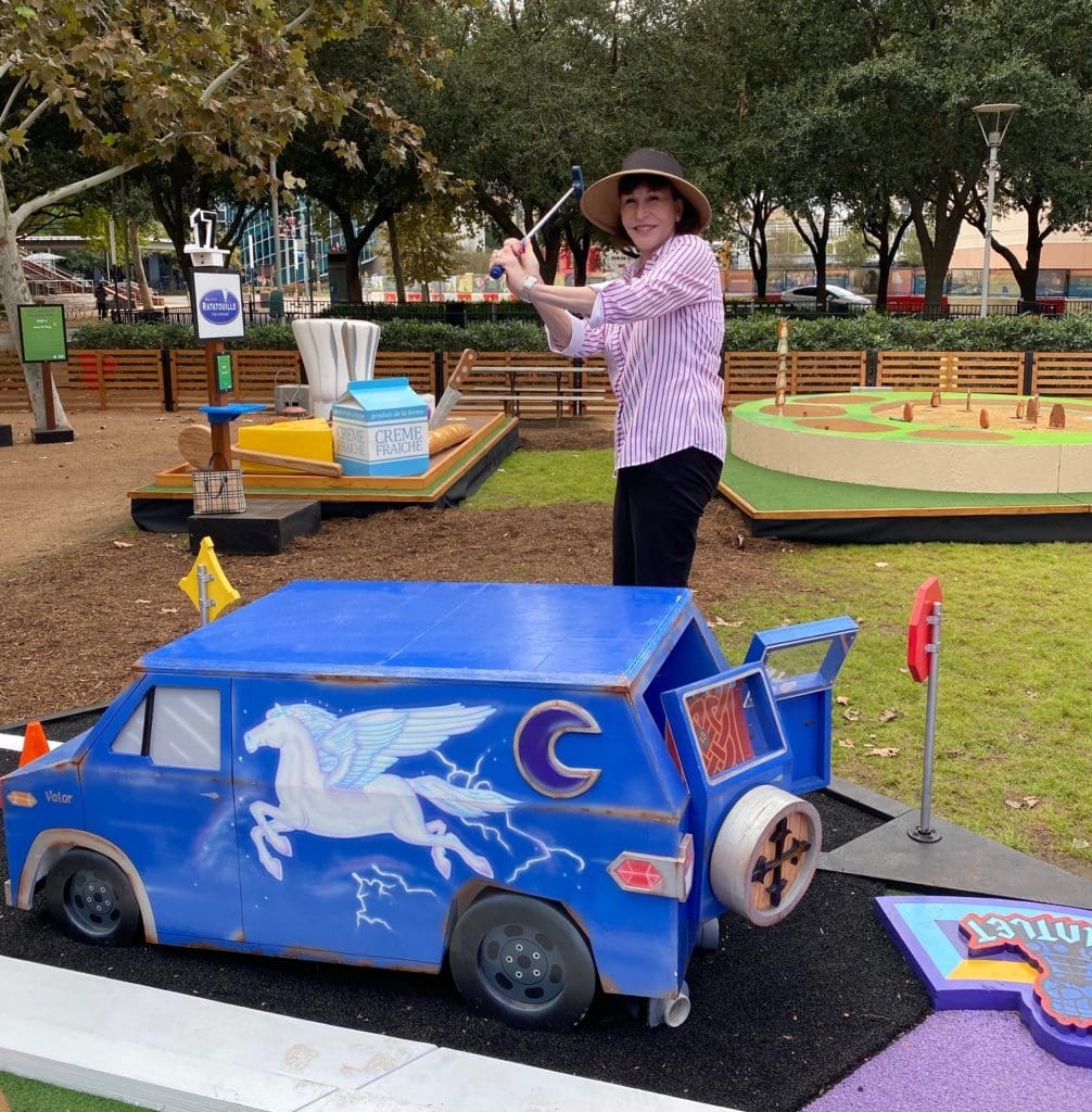 PaperCity social and lifestyle editor Shelby Hodge tries her hand at Pixar Putt now open at Discovery Green.