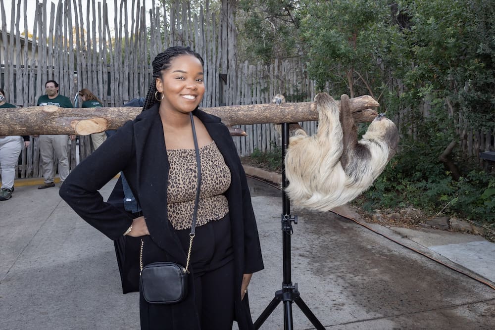 Lauren Dillard with a sloth at the 30th anniversary of Zoo to Do in Dallas. (Photo by Thomas Garza Photography)