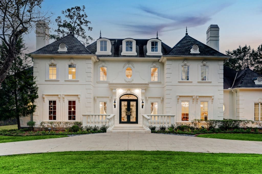 This 9,871 square foot French chateau-style mansion in Piney Point hits the market for $4,195,000. Compass' Sabiha Rehmatulla has the listing. (Photo by TK Images)