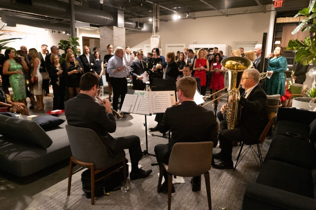 Brass musicians from the Houston Symphony perform at the Young Associates Council holiday party at BeDESIGN. (Photo by Daniel Ortiz)