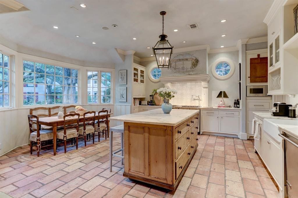 The fully outfitted kitchen at 1821 Sharp Place includes an informal dining area. (Photo by TK Images)