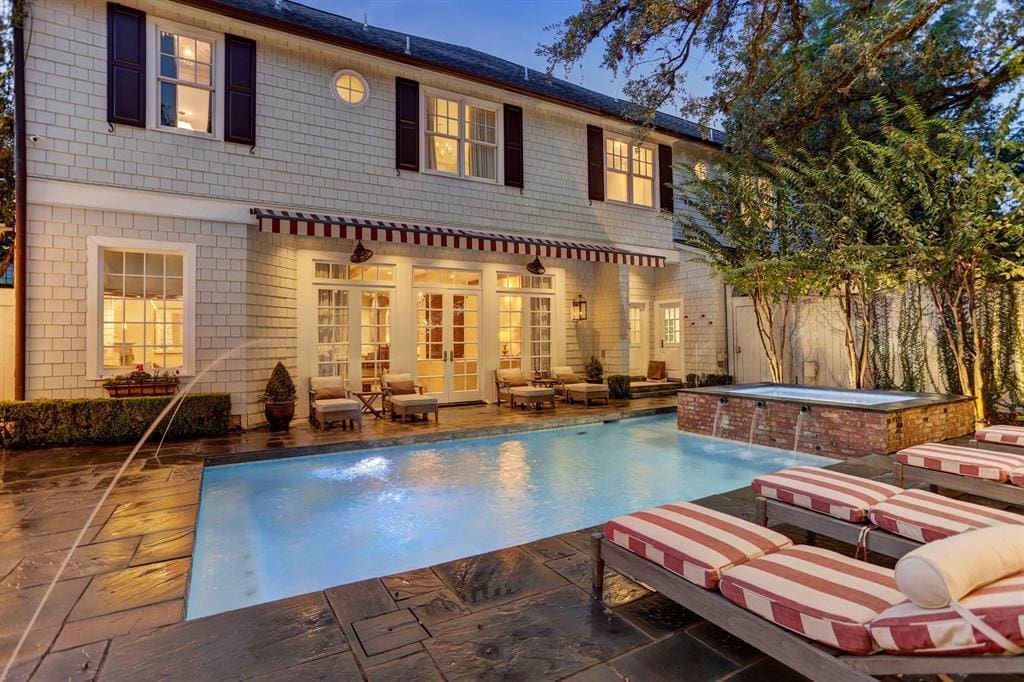 The pool terrace and surrounding features take up most of the backyard at 1821 Sharp Place.  (Photo by TK Images)