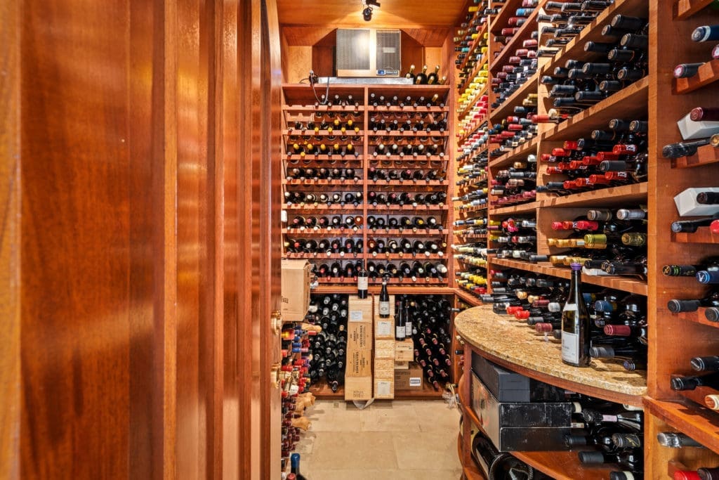This Kirby Drive home features a 2,000+ bottle wine vault.