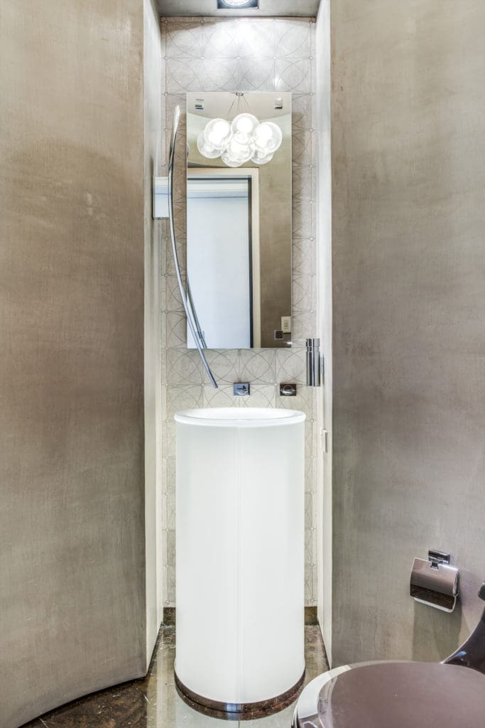 A pretty half-bathroom is an escape all on its own. (Photo by Shoot2Sell for Douglas Elliman)