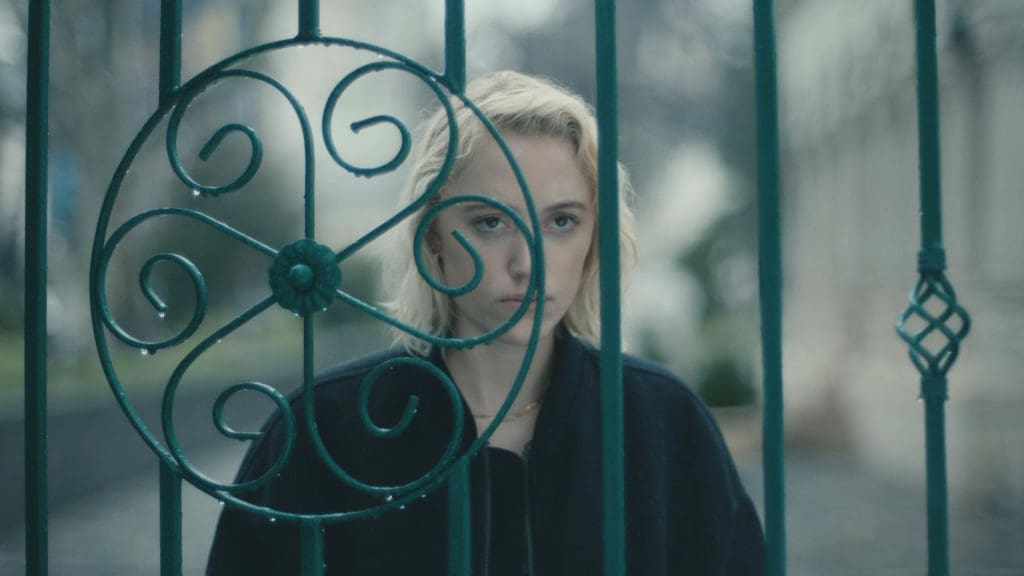 Maika Monroe appears in <i>Watcher</i> directed by Chloe Okuno.