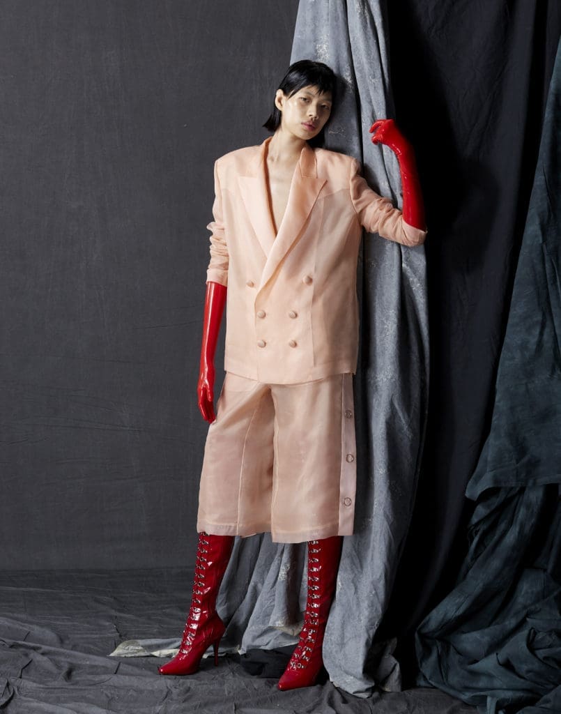 Bach Mai blush silk organza double breasted tailored jacket with silk satin organza revers and chiffon lining, tearaway pants with silk satin organza plackets, silk chiffon lining, and rose gold ring snaps. (Photo by Dimitri Hyacinthe)