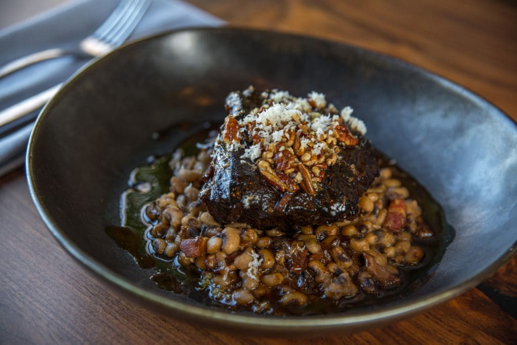 Back Table's hearty six-hour braised chuck short ribs with black eyed peas, a pecan gremolata and fresh horseradish. (Photo by Photos Care of Back Table Kitchen & Bar)