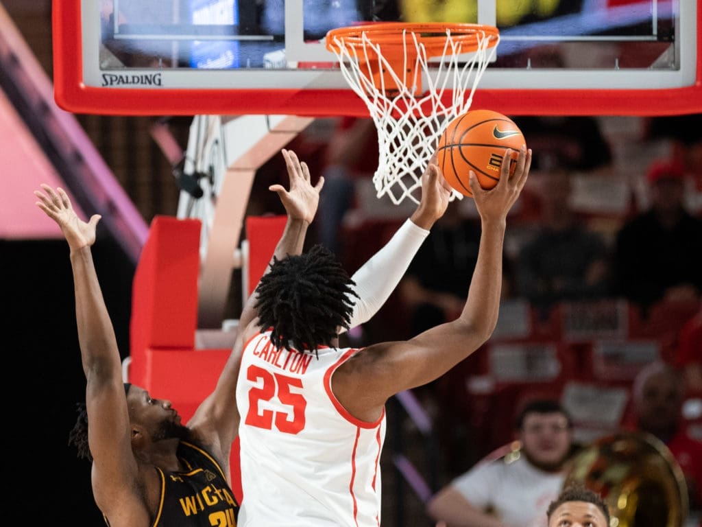 When Josh Carlton gets near the rim, he's a handful for UH's opponents.  (Photo by F. Carter Smith)