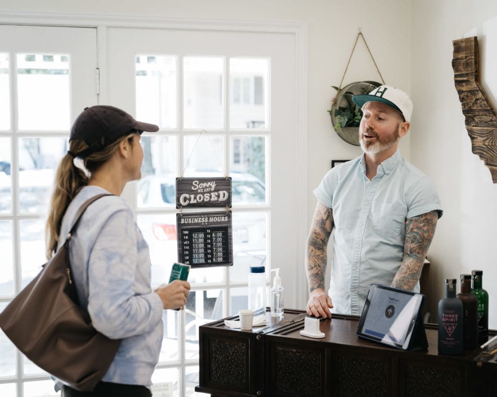 Sipple owner Danny Frounfelkner discusses the alcohol-free offerings at the shop he runs with his wife, Helenita, in Rice Village.  (Photo by Therron Francis)