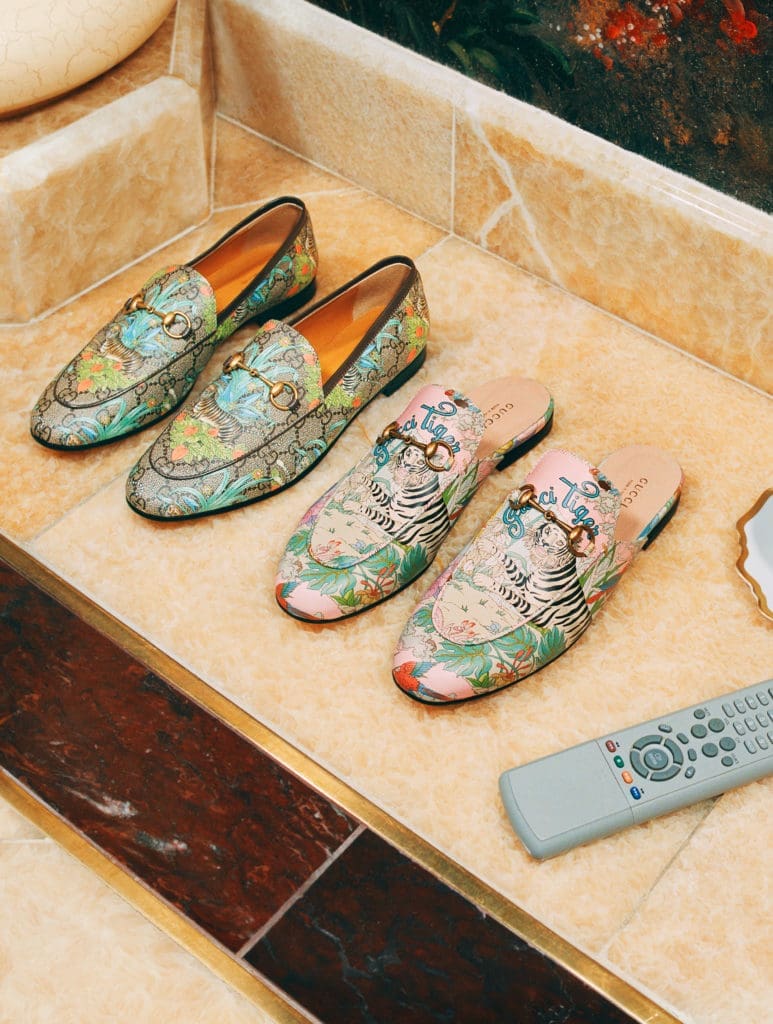 Gucci salutes the Year of the Tiger with a complete ready-to-wear and accessories collection embellished with the tiger image or 'Gucci Tiger' labeling.