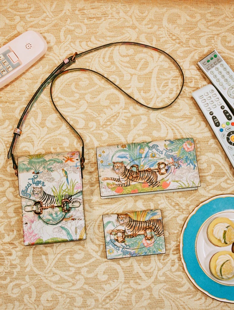 Gucci salutes the Year of the Tiger with a complete ready-to-wear and accessories collection embellished with the tiger image or 'Gucci Tiger' labeling.