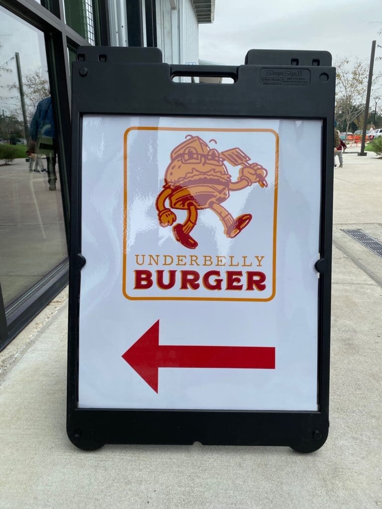 Look for this sign to Underbelly Burger at the back of Houston Farmers Market in the left flank as you face the entrance. (Photo by Shelby Hodge)