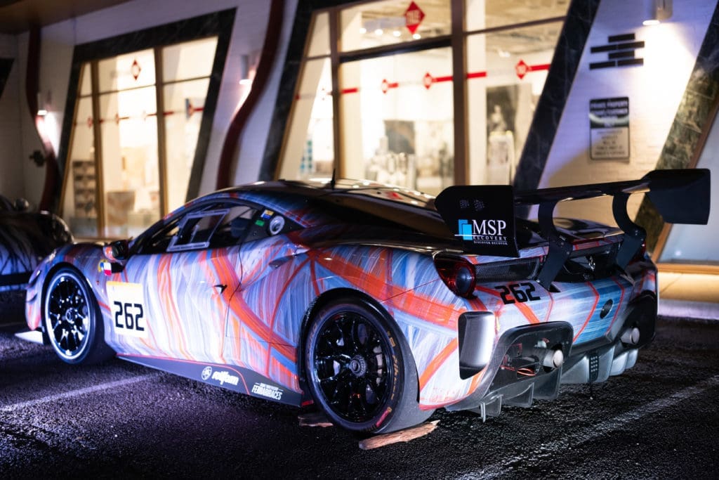 ONe of two Ferarri's wrapped in artist Christopher Martin's work welcoming guests to the opening of his namesake gallery in Upper Kirby District's Gallery Row. (Photo by Daniel Ortiz)