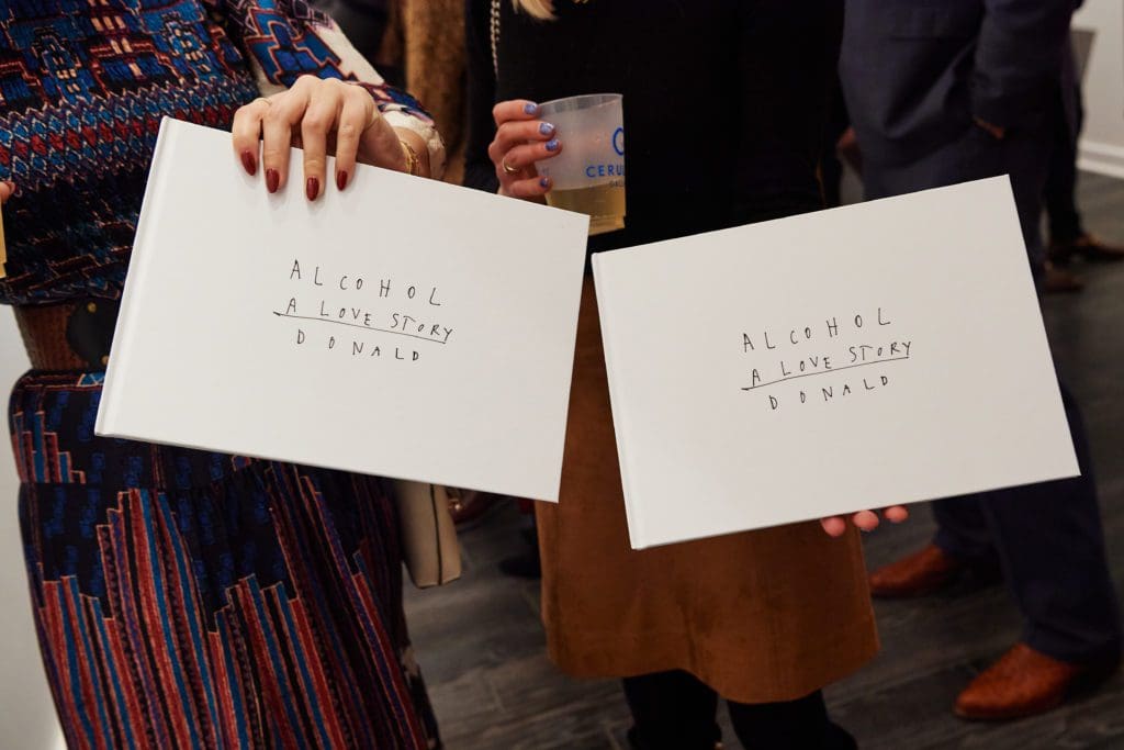 The exhibit features artwork from Robertson's book "Alcohol A Love Story" (Photo by Jonathan Zizzo)