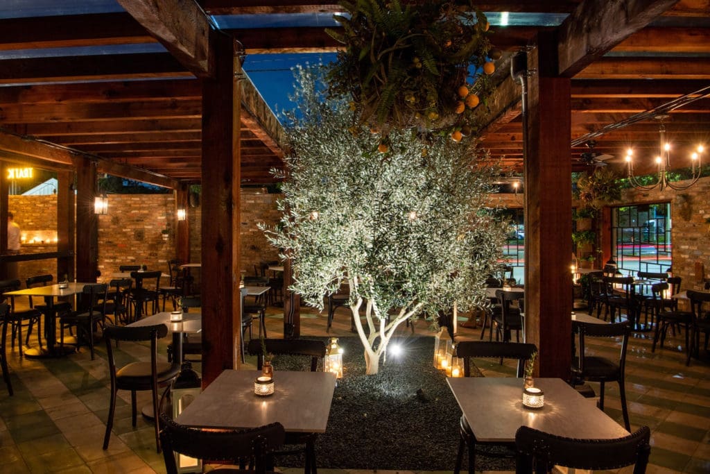 Trattoria Sofia, a new Heights restaurant from Benjamin Berg features an outdoor patio with a grand olive tree. (Photo by Michelle Watson)