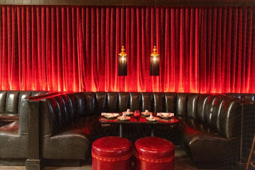 Formerly Capitol Pub, the new Sfuzzi space features the same kinds of tables and booths from the original spot on McKinney Avenue. (Photo by Kathy Tran)