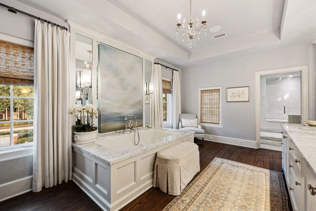 Her bath in the owner's suite in the 1722 River Oaks Boulevard home of Frances and Tony Buzbee. (Photo by Courtesy of Josh Gremillion for Douglas Elliman)