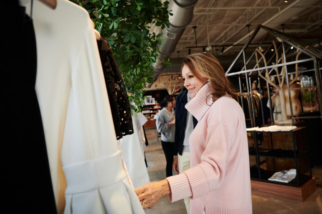 Claire Emanuelson sifting through Adam Lippes' designs (Photo by Jonathan Zizzo)